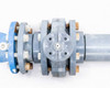 Arad WM80 meter and valve — close-up of valve flange end cap showing bolt-hole pattern and gray PVC or composite flange plate