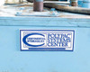 Continental Hydraulics Polypac Systems Center logo plaque mounted on front of blue reservoir tank