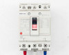 Mitsubishi NF125-CW front panel showing toggle switch in ON position and 75A rating label