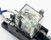 Close-up of Omron LY2N-D2 relay in socket showing label: LY2N-D2, 10A 24VDC, and green LED indicator