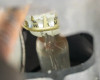 Close-up macro view of vintage lamp bulb base with crown-style ceramic socket and bayonet-style contact pins