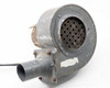 Torrington Electric blower — opposite side view of round housing face with perforated inlet grille, tube outlet visible, power cord trailing from motor; overall paint wear and surface corrosion visible