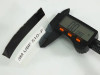 3M UBF 510-F labeled film sample strip held in digital caliper measuring approximately 0.88 inches wide showing film thickness and flexibility