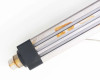 Exlar KM60 actuator rail detail showing yellow Turck magnetic sensors mounted in T-slot channel
