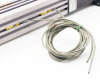 Exlar KM60 actuator sensor cable coiled separately showing loose wire ends
