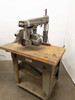 DeWalt 7790 radial arm saw with work table – right-side three-quarter view showing full machine on stand