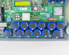 SMA SB3000US internal PCB — close-up of blue electrolytic capacitor bank on main circuit board