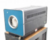 Lindberg 54454 Hevi-Duty Tube Furnace blue end-panel and black vented chassis, seated on controller cabinet – side angle view