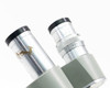 Close-up of left and right eyepiece tubes showing oxidation and surface spotting on left tube and diopter scale on right