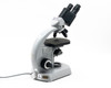 Carl Zeiss 470916-9902 binocular microscope right-side view showing binocular head, stage, and power cord