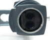 Underside of AO 569 zoom head showing dual objective lenses, partial label reading 560-22, and objective housing detail