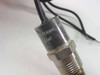 Fenwal 08-81 thermostat probe close-up of body label reading FENWAL 08-81 and 104F temperature rating