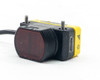 Banner QS30D sensor front face close-up showing output indicator window and sensitivity adjustment knob