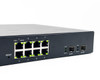 Araknis AN-210-SW-R-8-POE rear panel overview showing IEC power inlet, 8x RJ-45 ports, reset button, and 2x SFP uplink ports