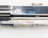 Keyence SL-V60H-T transmitter and SL-V60H-R receiver lying parallel showing full-length bar housings, blue Keyence branding labels, and specification sticker detail