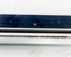 Close-up of Keyence SL-V60H receiver bar face showing lens array surface with surface marks and minor soiling on the optical window