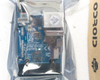 ODROID-MC1 Solo PCB through antistatic bag showing board markings REV 0.1, Made in Korea, CE and FCC marks, 12V and GND pads