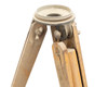 Top view of tripod head mount and upper leg hinge assembly showing metal casting and leg locking hardware