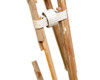 Wooden leg detail showing broken leg section — leg spreader clamp and weathered wood condition visible