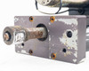 AccuWeb MME-1 7303-01 web guide actuator mounting plate — front face showing heavy wear, paint loss, surface rust, and output shaft