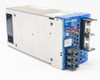 Omron S8VM-30024C — angled rear view showing fan end, output terminals, blue side panel, and CN connector with attached wiring leads