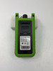 KomShine KLS-35 Optical Light Source rear view showing label with 1310/1550nm wavelength, FC/SC/PC connector spec, test range, and serial number barcode — green rubber protective boot visible