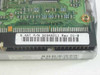 Quantum Fireball 7.5AT PCB underside label showing part number SE84A011 Rev 01-B and 8.4AT designation on green circuit board