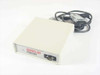 Percon Series 20 20-000-00 barcode decoder front-left angle view showing DB9 serial port and included IBM PC cable