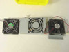 Close-up of three mixed 12V computer case cooling fans side by side — left is a black 80mm fan with green hub, center is a gray-shrouded fan, right is a Delta 80mm fan with red and black leads