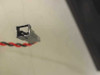 Close-up of small square 2-pin connector on red/black wire lead from cooling fan