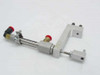 SMC NCDJ2L6-050R-H7A1LS pneumatic cylinder assembly showing full bracket, brass push-in fittings, and solenoid valves from alternate angle