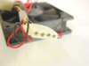 Close-up of 4-pin Molex power connector attached to DC brushless cooling fan wire leads