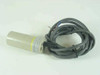 Omron E2K-C25ME1 Capacitive Proximity Switch Sensor full body view with attached gray lead cable