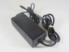 HP 0950-4483 AC/DC power adapter with attached AC power cord — front and side view showing black brick body and barrel plug output