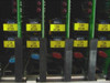 Close-up of installed DTS line cards with yellow labels showing channel 134 and frequency codes 87.23, 87.38, 87.34, and 87.33 with colored indicator lights