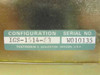 Tektronix IGS-1614-63 configuration label showing model IGS-1614-63 and serial number W010135, manufactured in Beaverton Oregon USA