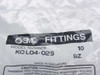 SMC Fittings label closeup showing model number KQL04-02S, quantity 10, BZ designation, Made in Singapore, with caution installation instructions