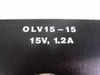Close-up of Elpac OLV15-15 front panel label showing model number OLV15-15 and output rating 15V 1.2A