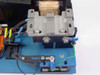 Stage controller open board assembly — close-up of machined aluminum coil/magnet stage with Staico transformer and wiring harness