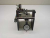 SMC pneumatic tolerance checking fixture front view showing analog dial indicator gauge mounted below linear slide assembly