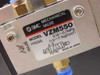 SMC VZM550 mechanical valve label showing model number, pressure range 0.15–0.7 MPa, Made in Japan