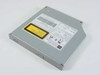 Toshiba XM-1602B 20X notebook ATAPI CD-ROM drive — top view showing label with model number, barcode, and yellow Class 1 laser warning sticker