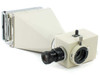 Olympus PM-10AD photomicrography camera head with PM-DL-W Polaroid back attached — front three-quarter view showing eyepiece and film back