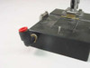Pneumatic toggle clamp fixture assembly – close-up of push-in elbow pneumatic fitting with red ring on left side of base