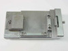 Top view of IC test fixture jig number 586135 showing spring-loaded side clamp mechanism and rectangular cavity
