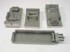 Lot of 4 FM precision machined IC test socket fixture jigs shown together on white background – overview