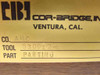Cor-Bridge Inc label on wood box lid showing brand logo, Ventura CA, Company AMC, Tool 530012-6, Part: Parting