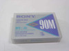 Sony DG90M DDS Data Cartridge front label showing 90M and DDS Media Recognition System branding in protective case