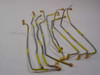 Group of semi-rigid SMA coaxial RF cables approximately 12 inches long with gold SMA connectors and yellow label sleeves, shown as example lot
