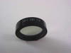 Ealing 35-3441 bandpass optical filter removed from case — side profile view showing black anodized ring mount with part number 35-3441-CN1 7-4 engraved on rim